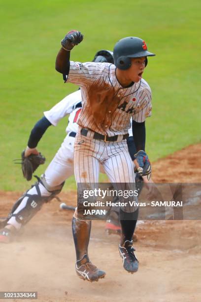 Hiromu Joshita of Japan celebrates after scoring in the 4th inning during the WBSC U-15 World Cup Super Round match between Japan and United States...