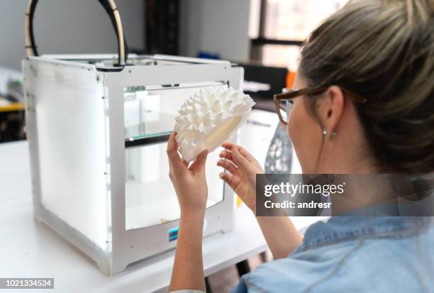 woman using a 3d printer - 3 d printing stock pictures, royalty-free photos & images