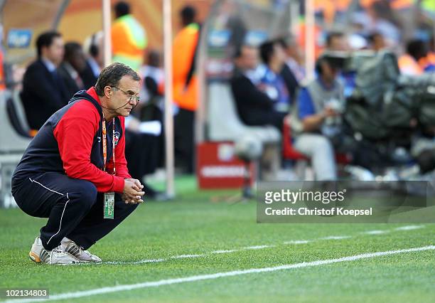 Marcelo Bielsa head coach of Chile looks thoughtful as he watches his team during the 2010 FIFA World Cup South Africa Group H match between Honduras...