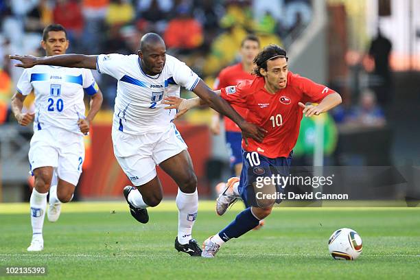 Jorge Valdivia of Chile is challenged by Osman Chavez of Honduras during the 2010 FIFA World Cup South Africa Group H match between Honduras and...