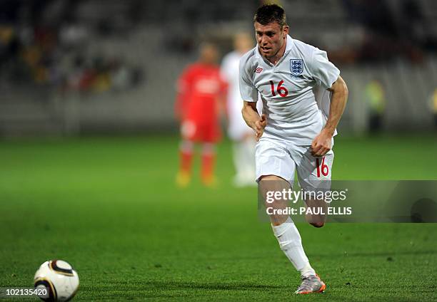 England's James Milner runs with the ball during a friendly football match between Platinum Stars and England at The Moruleng Stadium near Rustenburg...