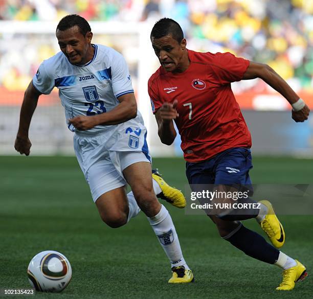 Honduras' defender Sergio Mendoza and Chile's striker Alexis Sanchez fight for the ball during the Group H first round 2010 World Cup football match...