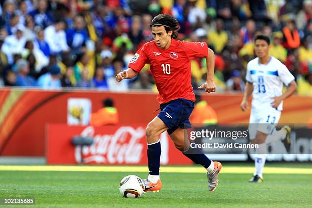 Jorge Valdivia of Chile runs with the ball during the 2010 FIFA World Cup South Africa Group H match between Honduras and Chile at the Mbombela...