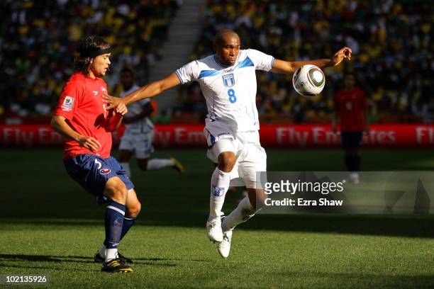 Wilson Palacios of Honduras holds off Waldo Ponce of Chile during the 2010 FIFA World Cup South Africa Group H match between Honduras and Chile at...