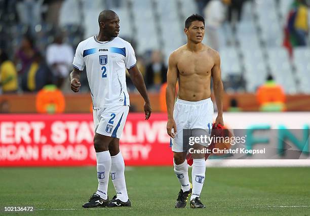 Osman Chavez and Roger Espinoza of Honduras look dejected after defeat in the 2010 FIFA World Cup South Africa Group H match between Honduras and...