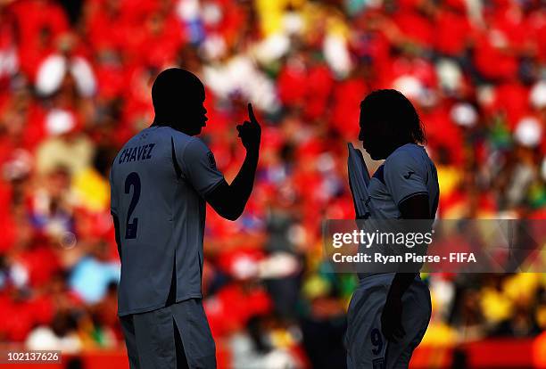 Osman Chavez and Carlos Pavon of Honduras talk tactics during the 2010 FIFA World Cup South Africa Group H match between Honduras and Chile at the...