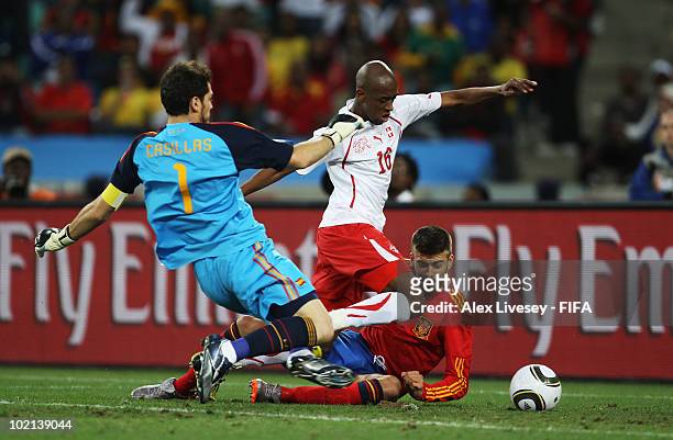 Gelson Fernandes of Switzerland scores the first goal while goalkeeper Iker Casillas and Gerard Pique of Spain can't save during the 2010 FIFA World...
