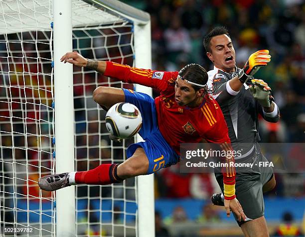 Sergio Ramos of Spain goes for a challenge with goalkeeper Diego Benaglio of Switzerland during the 2010 FIFA World Cup South Africa Group H match...