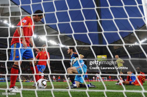 Joan Capdevila, Carles Puyol, Iker Casillas and Gerard Pique of Spain are stunned after conceding a goal by Gelson Fernandes of Switzerland during...