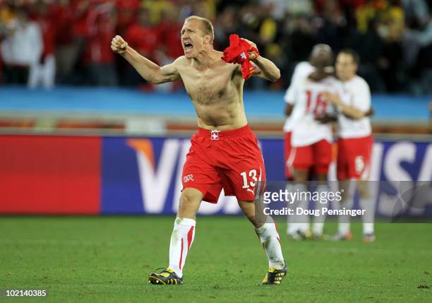 Stephane Grichting of Switzerland celebrates after victory in the 2010 FIFA World Cup South Africa Group H match between Spain and Switzerland at...