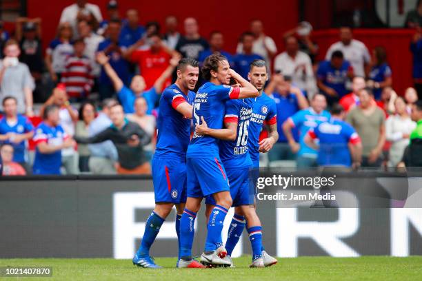 Milton Caraglio of Cruz Azul celebrates after scoring the third goal of his team with teammates during the fifth round match between Cruz Azul and...