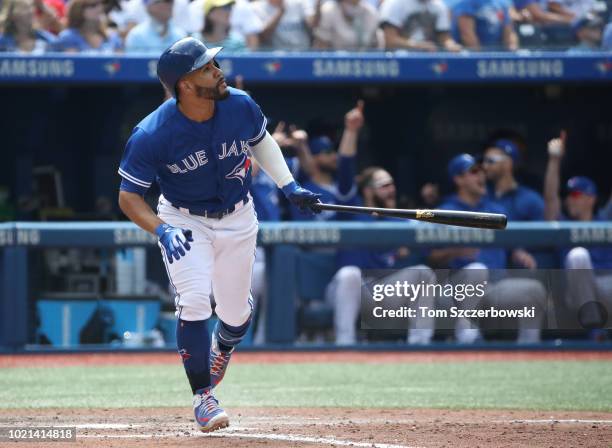 Devon Travis of the Toronto Blue Jays hits a three-run home run in the eighth inning during MLB game action against the Baltimore Orioles at Rogers...