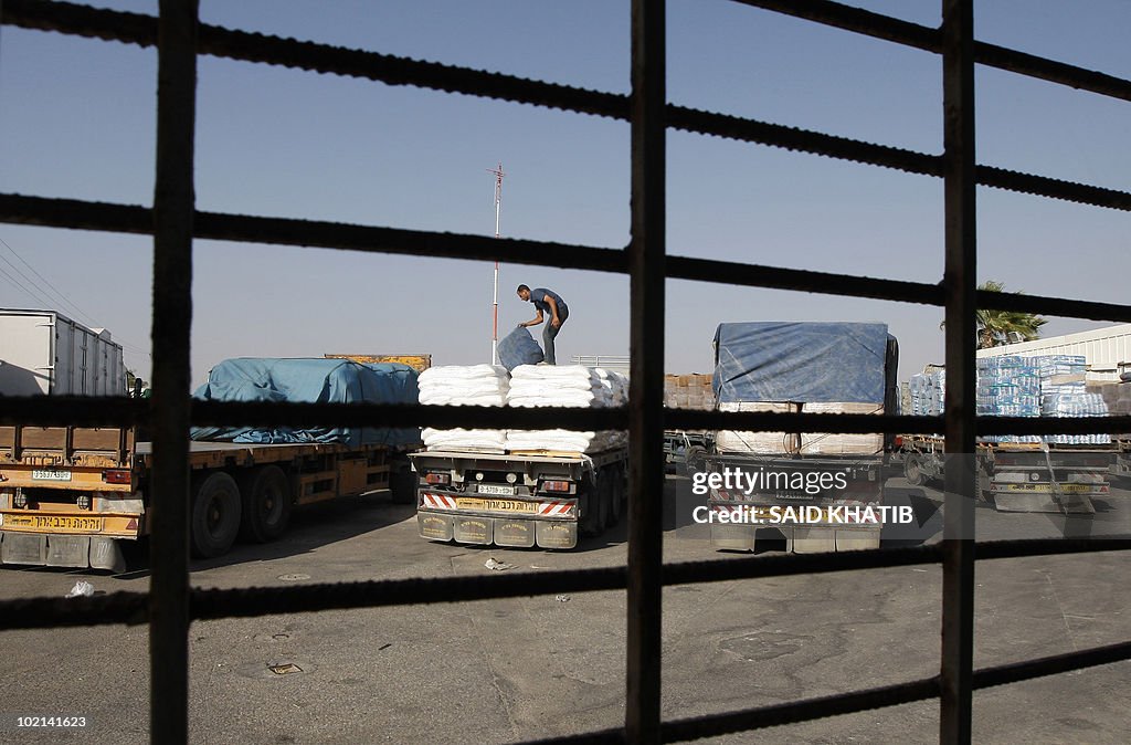 A Palestinian worker check a truck carry