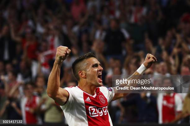 Dusan Tadic of Ajax celebrates scoring his teams third goal of the game during the UEFA Champions League Play-off 1st leg match between Ajax and...
