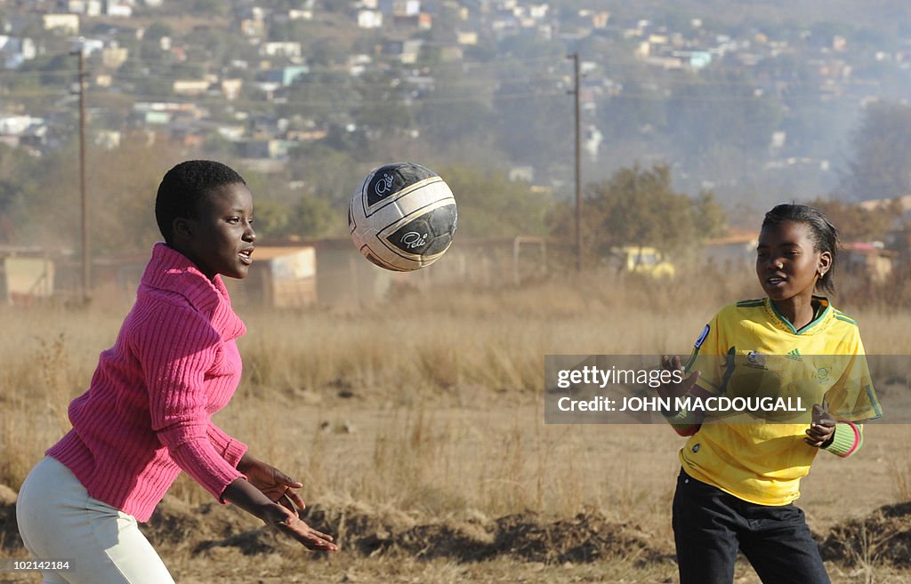 South African girls play with a ball at