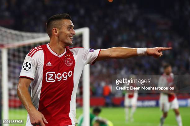 Dusan Tadic of Ajax celebrates scoring his teams third goal of the game during the UEFA Champions League Play-off 1st leg match between Ajax and...