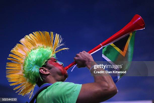 South African fan blows a vuvuzela at a fan viewing area on June 16, 2010 in Cape Town, South Africa. South Africa take on Uruguay tonight at the...