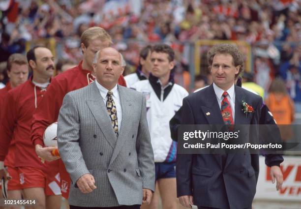 Liverpool interim manager Ronnie Moran and Sunderland manager Malcolm Crosby lead out their respective teams before the FA Cup Final at Wembley...