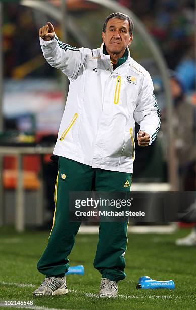Carlos Alberto Parreira head coach of South Africa directs his players during the 2010 FIFA World Cup South Africa Group A match between South Africa...