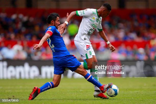 Rafael Baca of Cruz Azul fights for the ball with Yairo Moreno of Leon during the fifth round match between Cruz Azul and Leon as part of the Torneo...
