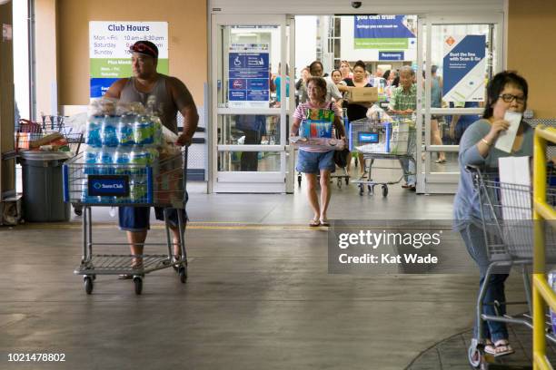 Crowds of shoppers with shopping carts full of supplies for Hurricane Lane exit Sams Club on Wednesday, August 22, 2018 in Honolulu, Hi. Lane is a...