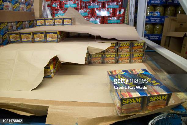 Cans of Spam, a Hawaiian staple, fly off the shelves at Sam's Club in preparation for Hurricane Lane at Sams Club on Wednesday, August 22, 2018 in...