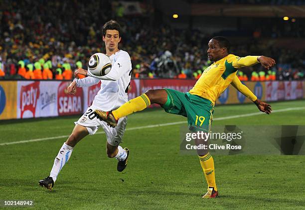 Surprise Moriri of South Africa and Alvaro Fernandez of Uruguaybattle for the ball of during the 2010 FIFA World Cup South Africa Group A match...