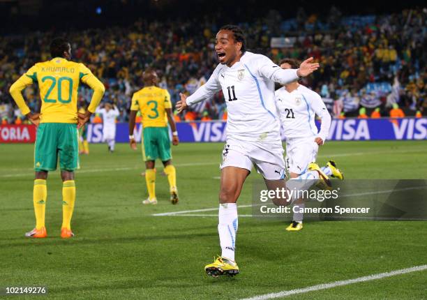 Alvaro Pereira of Uruguay celebrates scoring the third goal during the 2010 FIFA World Cup South Africa Group A match between South Africa and...