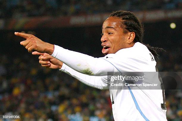 Alvaro Pereira of Uruguay celebrates scoring the third goal during the 2010 FIFA World Cup South Africa Group A match between South Africa and...