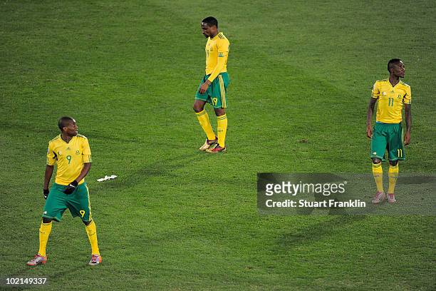 Katlego Mphela , Surprise Moriri and Teko Modise of South Africa are dejected after defeat in the 2010 FIFA World Cup South Africa Group A match...