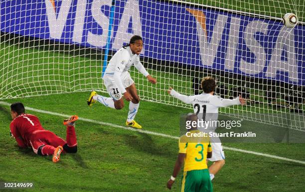 Alvaro Pereira of Uruguay celebrates scoring the third goal during the 2010 FIFA World Cup South Africa Group A match between South Africa and...