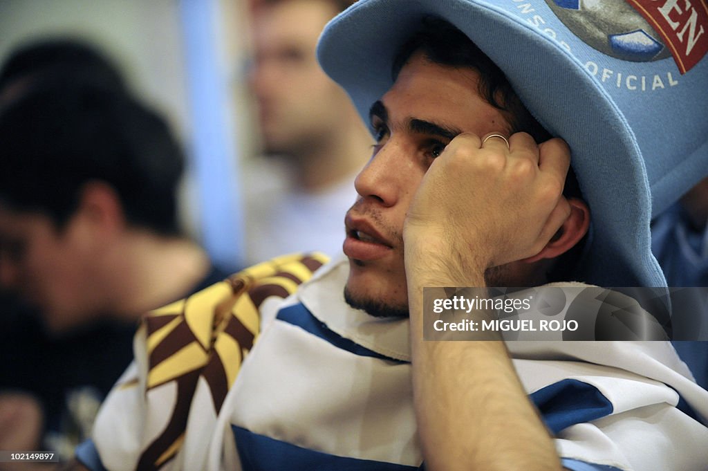 A Uruguayan football fan gestures as he
