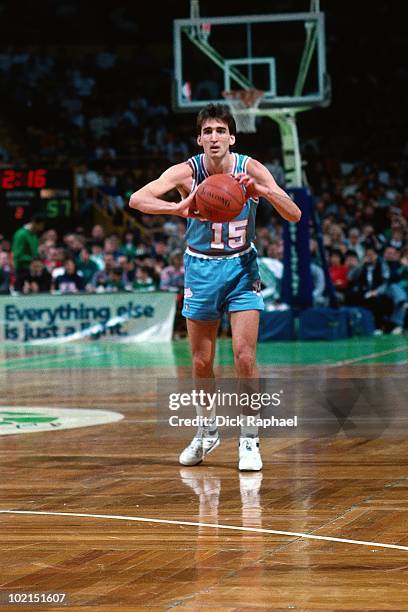 Vinny Del Negro of the Sacramento Kings passes against the Boston Celtics during a game played in 1990 at the Boston Garden in Boston, Massachusetts....