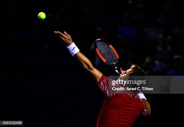 Pablo Carreno Busta of Spain serves to Peter Gojowczyk of Germany during their match on day three of the Winston-Salem Open at Wake Forest University...