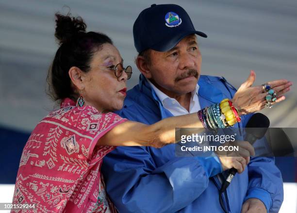Nicaraguan Vice President Rosario Murillo gestures next to his husband Nicaraguan President Daniel Ortega, during a rally marking the 40th...