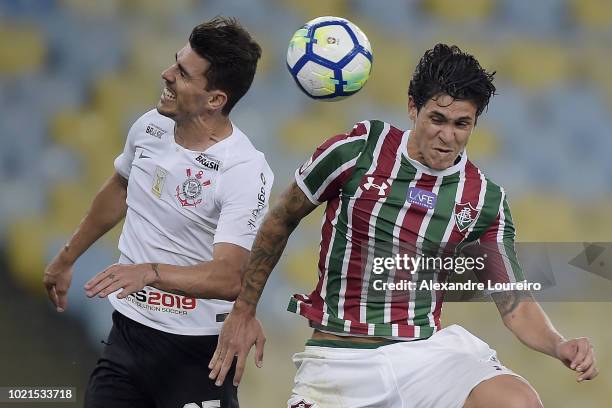 Pedro of Fluminense struggles for the ball with Pedro Henrique of Corinthians during the match between Fluminense and Corinthians as part of...