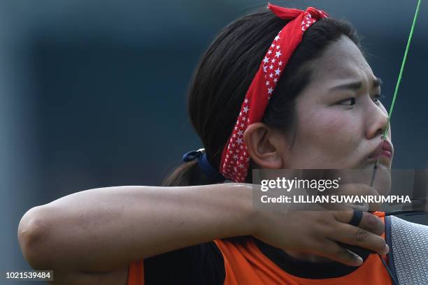 Bhutan's Sonam Dema takes part in the recurve women's individual elimination round archery event at the 2018 Asian Games in Jakarta on August 23,...