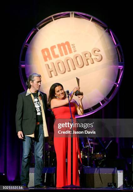 Christy Wilson Myers and David Wilson speak onstage during the 12th Annual ACM Honors at Ryman Auditorium on August 22, 2018 in Nashville, Tennessee.