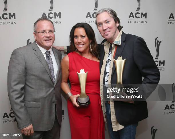 Academy of Country Music CEO Pete Fisher, Christy Wilson Myers and David Wilson take photos during the 12th Annual ACM Honors at Ryman Auditorium on...