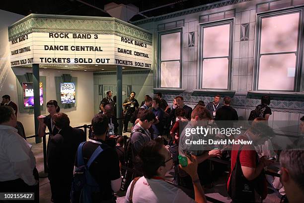 People line up to play Dance Central and Rockband 3 at the MTV Games exhibit during the annual Electronic Entertainment Expo at the Los Angeles...