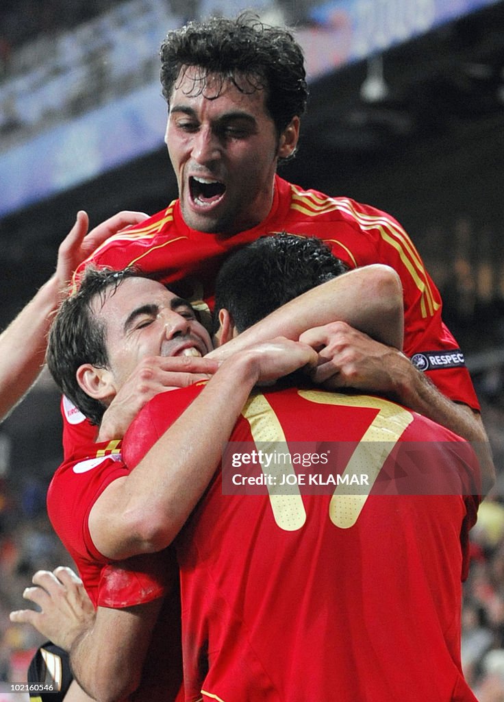 Spanish forward Daniel Guiza (back) is c
