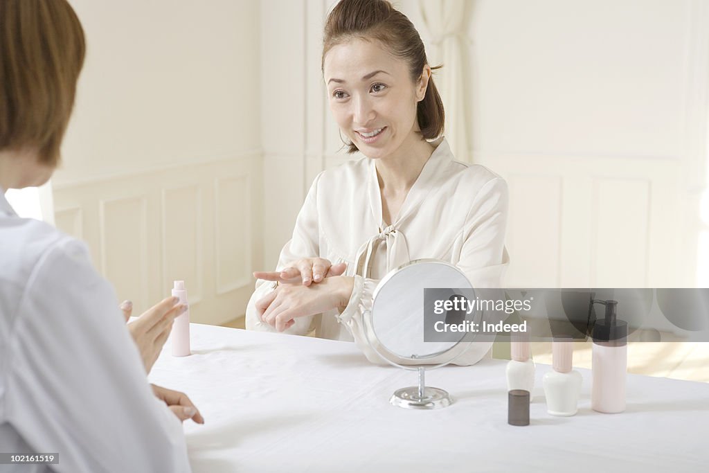 Mature woman talking with a beauty expert