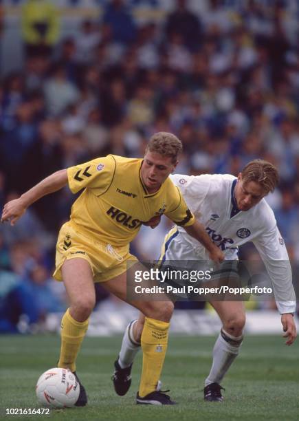 Paul Gascoigne of Tottenham Hotspur is challenged by David Batty of Leeds United during a Barclays League Division One match at Elland Road on...