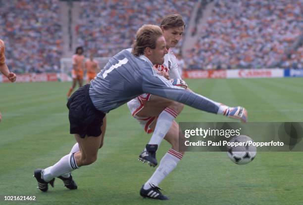 Hans van Breukelen of the Netherlands brings down Sergey Gotsmanov of the Soviet Union for a penalty during the UEFA Euro 88 Final at the...