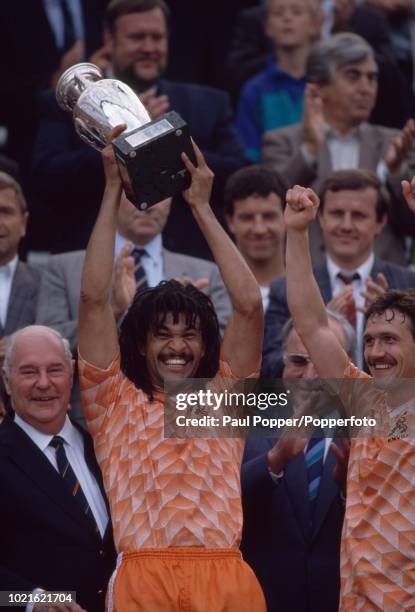 Ruud Gullit of the Netherlands lifts the trophy after the UEFA Euro 88 Final between the Soviet Union and the Netherlands at the Olympiastadion on...