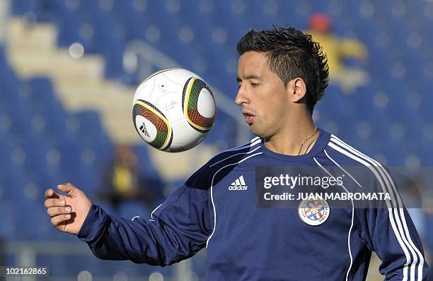 Paraguay's forward Lucas Barrios controls the ball during a training session at Harry Gwala stadium in Pietermaritzburg on June 6, 2010 ahead of the...