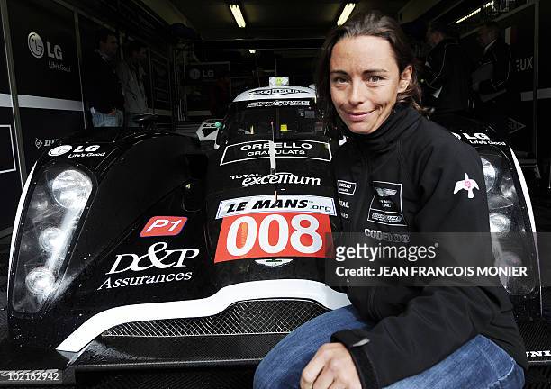 Belgian Vanina Ickx poses next to her Lola B09/60 Aston Martin N° 009 on June 8, 2010 in Le Mans, western France. Fifty-six cars with 168 drivers...