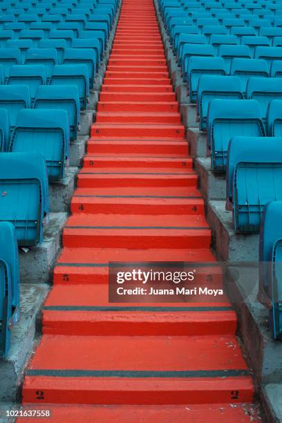 staircase and seats in a football stadium, form a symmetrical composition. - madrid football stock pictures, royalty-free photos & images