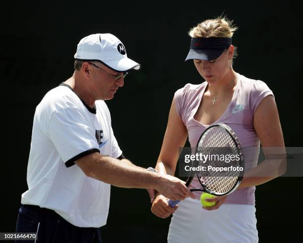 Maria Sharapova of Russia takes advice from her father Yuri during a practice session at the 2007 Sony Ericsson Open at the Tennis Center at Crandon...