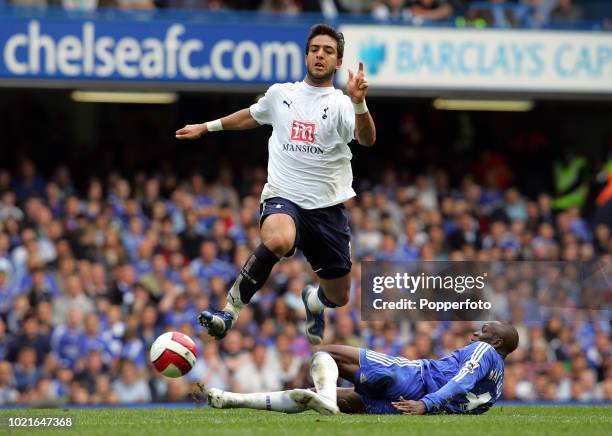 Claude Makelele of Chelsea slides in to tackle Ahmed Mido of Tottenham Hotspur during the Barclays Premiership match between Chelsea and Tottenham...